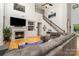Comfortable living room with a fireplace, built-in shelves, and a large sectional sofa at 13406 Ada Ct, Charlotte, NC 28213
