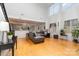 Bright open-concept living room with hardwood floors and kitchen view at 13406 Ada Ct, Charlotte, NC 28213