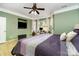Comfortable main bedroom features a large window for natural light, recessed tv, and inviting bed at 13406 Ada Ct, Charlotte, NC 28213