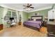 Comfortable main bedroom features a large window for natural light, desk and inviting bed at 13406 Ada Ct, Charlotte, NC 28213