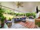 Covered patio with comfortable seating and outdoor fan at 13406 Ada Ct, Charlotte, NC 28213