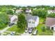 An aerial view shows the home's manicured lawn and multi-car driveway in a neighborhood setting at 1346 Mandy Place Ct, Charlotte, NC 28216