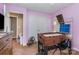 A cozy bedroom is furnished with a foosball table and decorated with pink walls at 1346 Mandy Place Ct, Charlotte, NC 28216