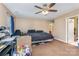 Bedroom features a ceiling fan and a doorway leading to a bathroom at 1346 Mandy Place Ct, Charlotte, NC 28216