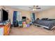 Large bedroom has two windows with blue curtains, ceiling fan, and closet at 1346 Mandy Place Ct, Charlotte, NC 28216
