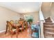 Bright dining room with hardwood floors, a chandelier, and a large window at 1346 Mandy Place Ct, Charlotte, NC 28216