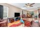 Inviting living room featuring hardwood floors, plush seating, and a ceiling fan at 1346 Mandy Place Ct, Charlotte, NC 28216