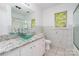 Bright bathroom featuring granite vanity, glass vessel sink, and tiled shower at 14834 Pawnee Trl, Matthews, NC 28104