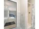 Bathroom features a shower and a pool visible in the next room through an open doorway at 14834 Pawnee Trl, Matthews, NC 28104