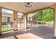 View from the spacious covered porch featuring an outdoor ceiling fan, looking into the backyard at 14834 Pawnee Trl, Matthews, NC 28104