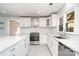 Updated kitchen featuring quartz counters, subway tile, and stainless steel appliances at 14834 Pawnee Trl, Matthews, NC 28104