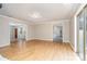 Open living room with hardwood floors and modern lighting fixtures at 14834 Pawnee Trl, Matthews, NC 28104