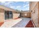 Stylish patio with sliding glass doors and brick walls, offering a private space for relaxation and enjoyment at 14834 Pawnee Trl, Matthews, NC 28104