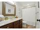 Bright bathroom with a sink vanity, a mirror, and a shower with curtain at 1534 Buffalo Shoals Rd, Lincolnton, NC 28092