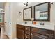 Bathroom boasts a double vanity with modern fixtures and two mirrors at 1534 Buffalo Shoals Rd, Lincolnton, NC 28092