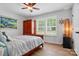 Bedroom with hardwood floors, a ceiling fan, and a window with natural light at 1534 Buffalo Shoals Rd, Lincolnton, NC 28092