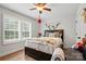 Bright bedroom with hardwood floors, a ceiling fan, and a window with natural light at 1534 Buffalo Shoals Rd, Lincolnton, NC 28092