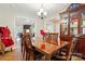 Traditional dining room features a wood table, chairs, and built in hutch with glass doors at 1534 Buffalo Shoals Rd, Lincolnton, NC 28092