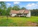 Charming single-story home featuring a manicured lawn, lovely landscaping, and classic curb appeal at 1534 Buffalo Shoals Rd, Lincolnton, NC 28092