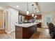 A luxurious kitchen boasts a granite island, modern pendant lighting, and updated stainless appliances at 1534 Buffalo Shoals Rd, Lincolnton, NC 28092