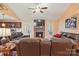 An open-concept living room features a beautiful stone fireplace and flows seamlessly into the kitchen at 1534 Buffalo Shoals Rd, Lincolnton, NC 28092