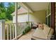 Relax on this cozy porch with comfortable seating, perfect for enjoying peaceful outdoor moments at 1534 Buffalo Shoals Rd, Lincolnton, NC 28092