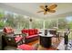 Relaxing screened porch with wood flooring, a ceiling fan, and outdoor furniture at 1534 Buffalo Shoals Rd, Lincolnton, NC 28092