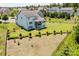 Aerial view highlighting the home's large backyard, complemented by mature trees and a partial fence at 15431 Cimarron Hills Ln, Charlotte, NC 28278