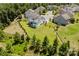 Bird's eye view highlighting the home's expansive yard, manicured lawn, fencing, and surrounding trees at 15431 Cimarron Hills Ln, Charlotte, NC 28278