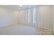 Bright bedroom with large windows, neutral carpet, and recessed lighting at 15431 Cimarron Hills Ln, Charlotte, NC 28278
