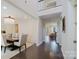Elegant dining area with hardwood floors, chandelier, and seamless flow to the living spaces at 15431 Cimarron Hills Ln, Charlotte, NC 28278
