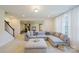 Inviting living room featuring plush seating, neutral tones, and an adjacent exercise area at 15431 Cimarron Hills Ln, Charlotte, NC 28278
