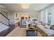 Bright living area with hardwood floors, large windows and seamless connection to the kitchen at 15431 Cimarron Hills Ln, Charlotte, NC 28278