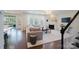 Cozy living room with a marble fireplace, large windows, and hardwood floors at 15431 Cimarron Hills Ln, Charlotte, NC 28278