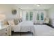 Comfortable main bedroom suite is filled with natural light and includes a sitting area at 15431 Cimarron Hills Ln, Charlotte, NC 28278