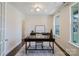 Bright office with hardwood floors, a large window, and stylish desk at 15431 Cimarron Hills Ln, Charlotte, NC 28278