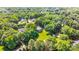 Expansive aerial view of the house and property highlighting the home's private, wooded setting at 1721 White Pond Ln, Waxhaw, NC 28173