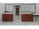 Bathroom featuring dual vanities with granite countertops and wood cabinetry at 1721 White Pond Ln, Waxhaw, NC 28173