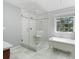 Spa-like bathroom featuring walk-in shower and elegant soaking tub with natural light at 1721 White Pond Ln, Waxhaw, NC 28173