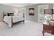 Cozy bedroom featuring soft carpeting, a four-poster bed and natural light at 1721 White Pond Ln, Waxhaw, NC 28173
