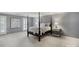 Tranquil bedroom with four poster bed, neutral tones, and plantation shutters at 1721 White Pond Ln, Waxhaw, NC 28173