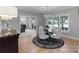 Inviting dining area with modern chandelier, large windows, and access to living spaces at 1721 White Pond Ln, Waxhaw, NC 28173