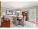 Formal dining room with hardwood floors, elegant furnishings, and ample natural light at 1721 White Pond Ln, Waxhaw, NC 28173