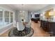 The dining room has hardwood floors with a view of the kitchen at 1721 White Pond Ln, Waxhaw, NC 28173