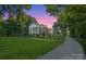 Elegant brick home with stately columns and meticulously landscaped grounds at 1721 White Pond Ln, Waxhaw, NC 28173