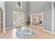 Bright foyer with hardwood floors, high ceilings, and an inviting view into the living room at 1721 White Pond Ln, Waxhaw, NC 28173