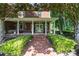 Charming brick home with a welcoming front porch and beautifully landscaped yard at 1721 White Pond Ln, Waxhaw, NC 28173