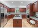 Spacious kitchen with stainless steel appliances, wooden cabinetry, and modern center island at 1721 White Pond Ln, Waxhaw, NC 28173