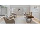 Comfortable office with stylish furniture, natural light, and hardwood floors at 1721 White Pond Ln, Waxhaw, NC 28173