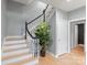 Bright foyer featuring staircase with modern black and white banister at 1721 White Pond Ln, Waxhaw, NC 28173